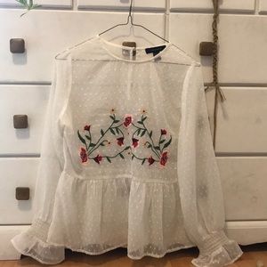 A sheer embroidered top